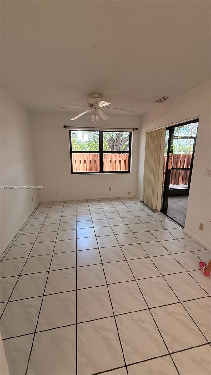 513 Racquet Club Road, Unit 55 Weston, FL 33326 - Photo 23 of 25 a view of an empty room and window