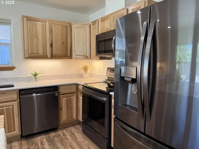 a spacious bathroom with a granite countertop sink and a large mirror
