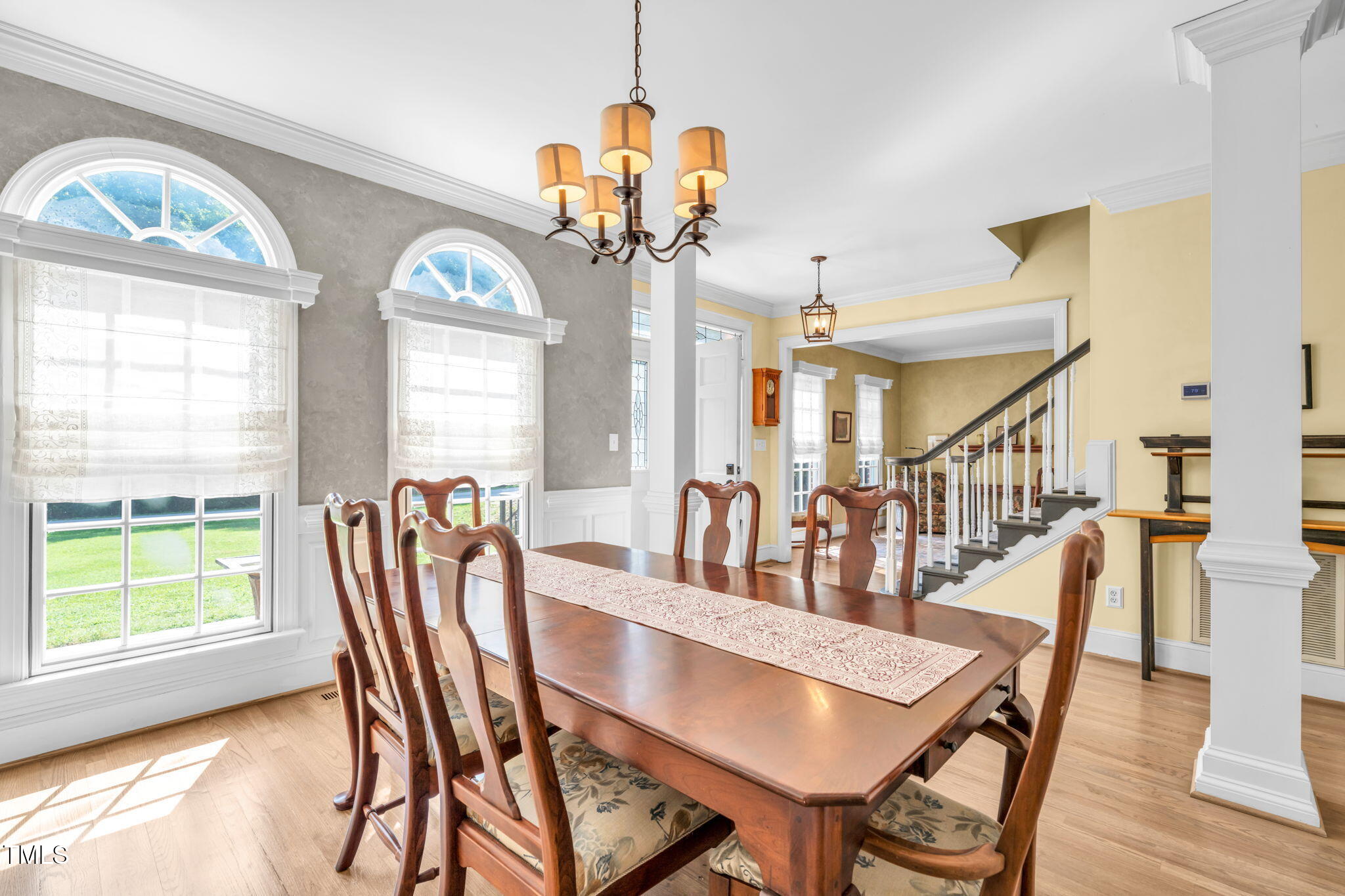 9009 Hometown Drive Raleigh, NC 27615 - Photo 11 of 82 a view of a dining room with furniture window and wooden floor