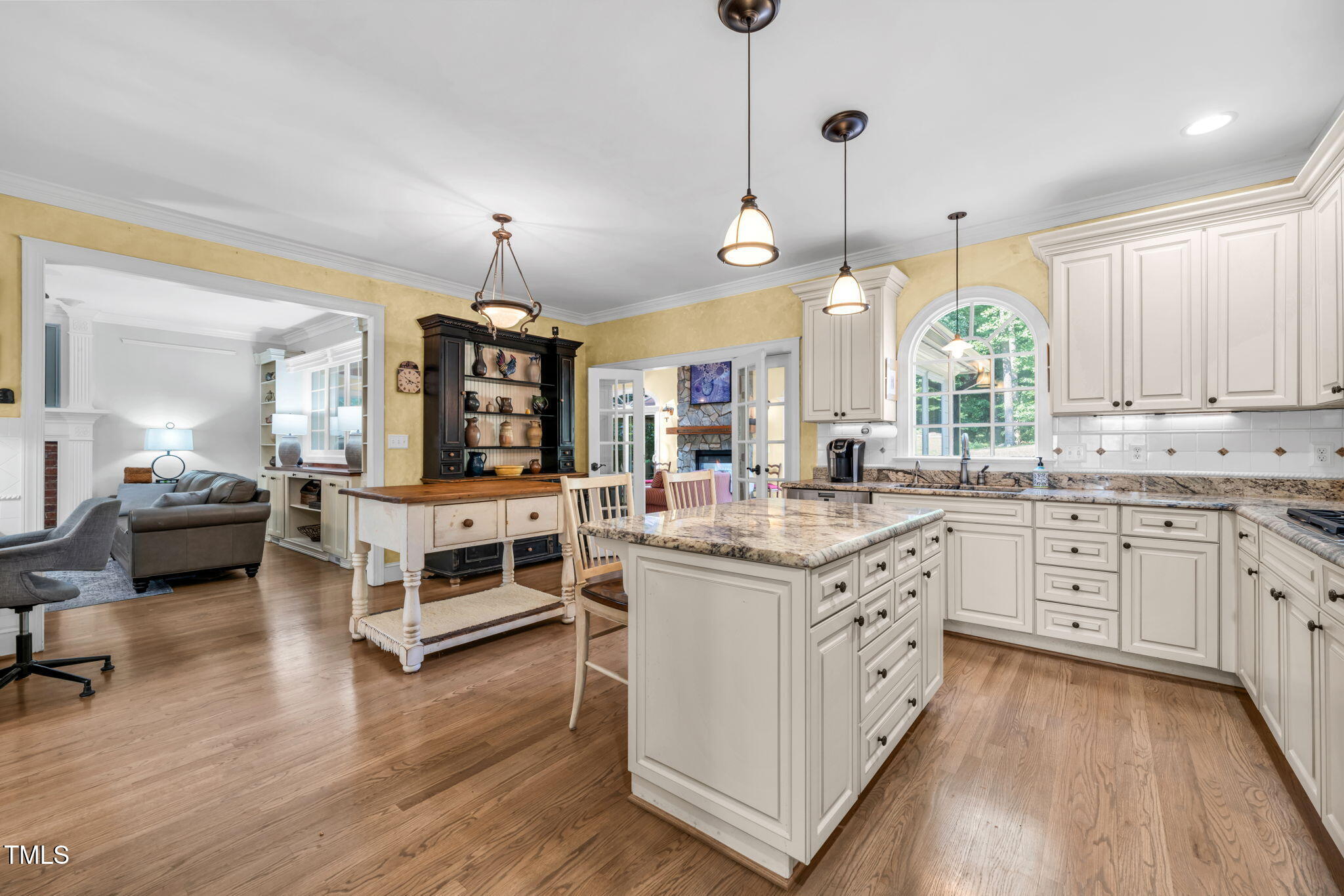 9009 Hometown Drive Raleigh, NC 27615 - Photo 19 of 82 a kitchen with granite countertop white cabinets and white appliances