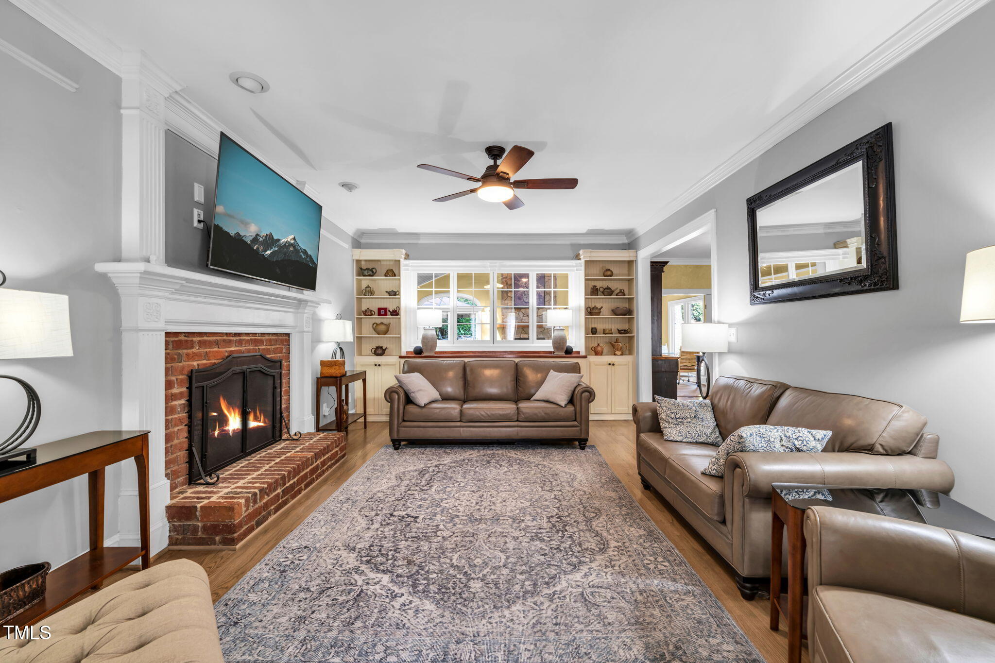 9009 Hometown Drive Raleigh, NC 27615 - Photo 22 of 82 a living room with furniture and a fireplace