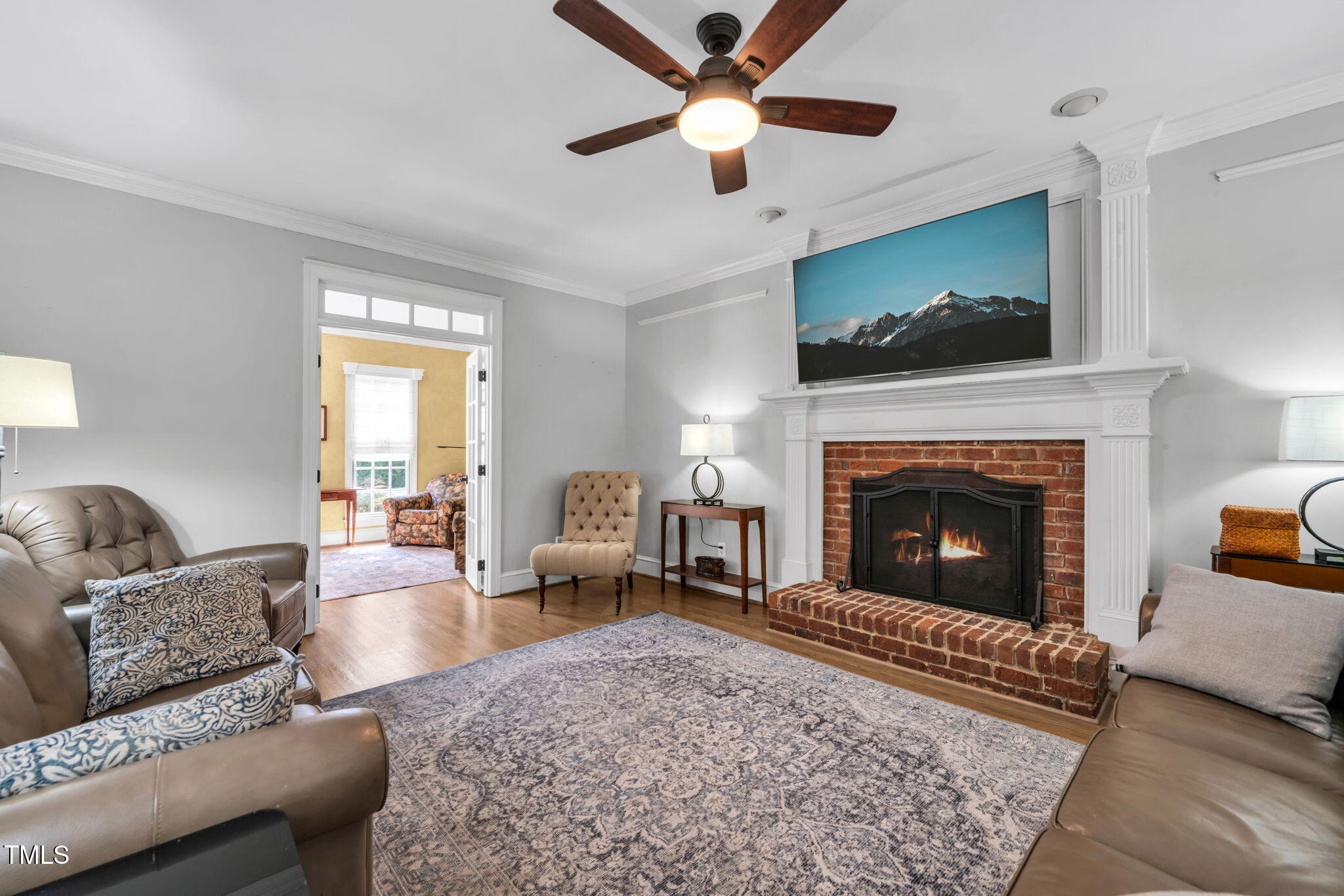 9009 Hometown Drive Raleigh, NC 27615 - Photo 23 of 82 a living room with furniture and a fireplace