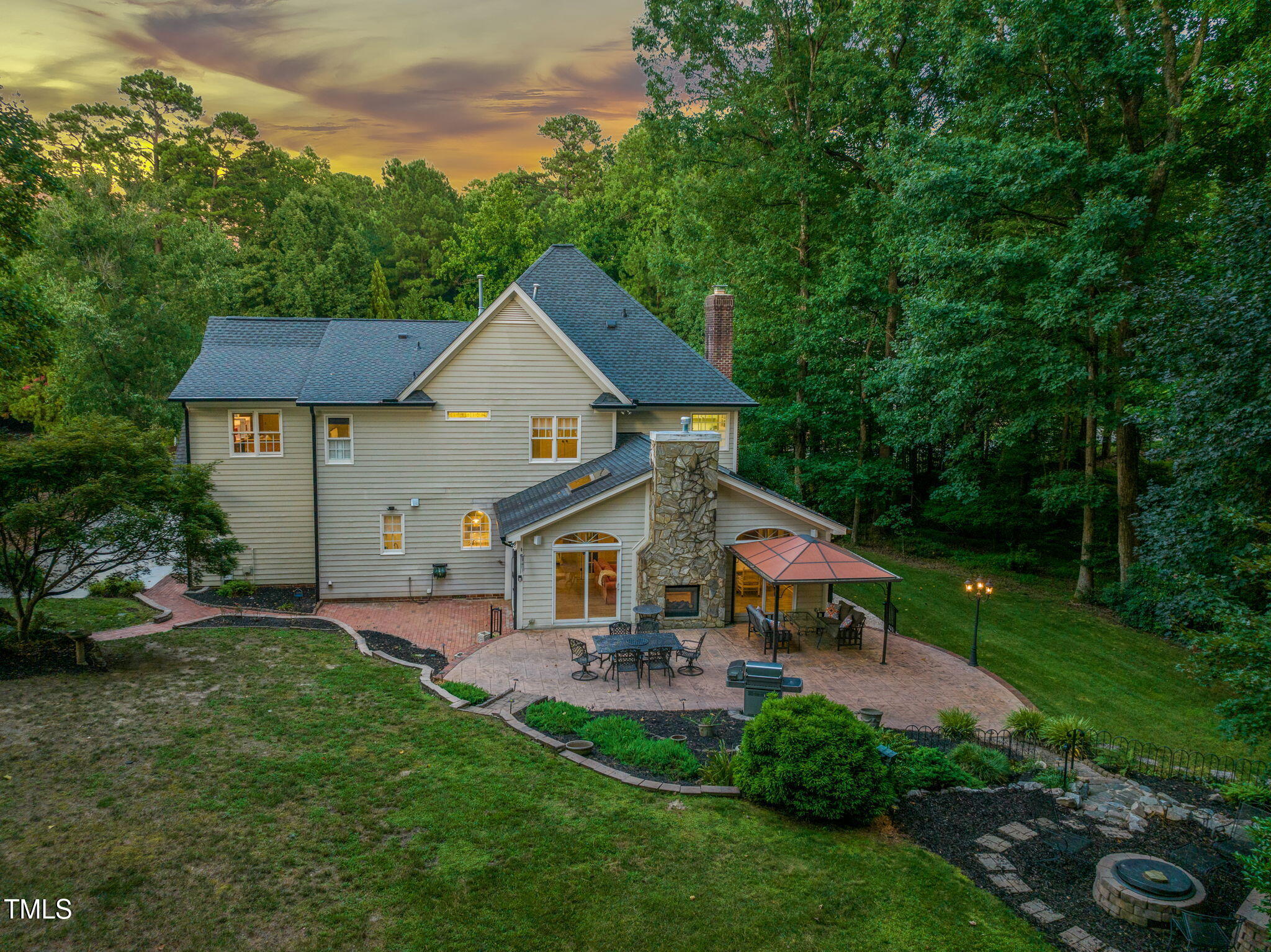 9009 Hometown Drive Raleigh, NC 27615 - Photo 2 of 82 a front view of a house with garden
