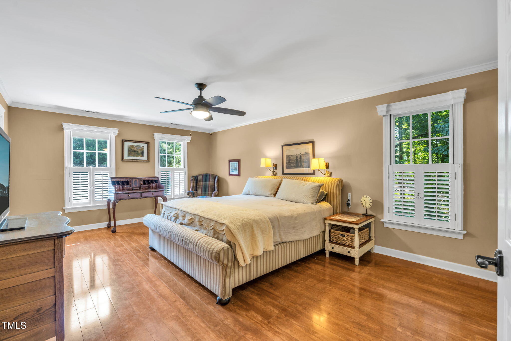 9009 Hometown Drive Raleigh, NC 27615 - Photo 31 of 82 a spacious bedroom with a bed and a table in it