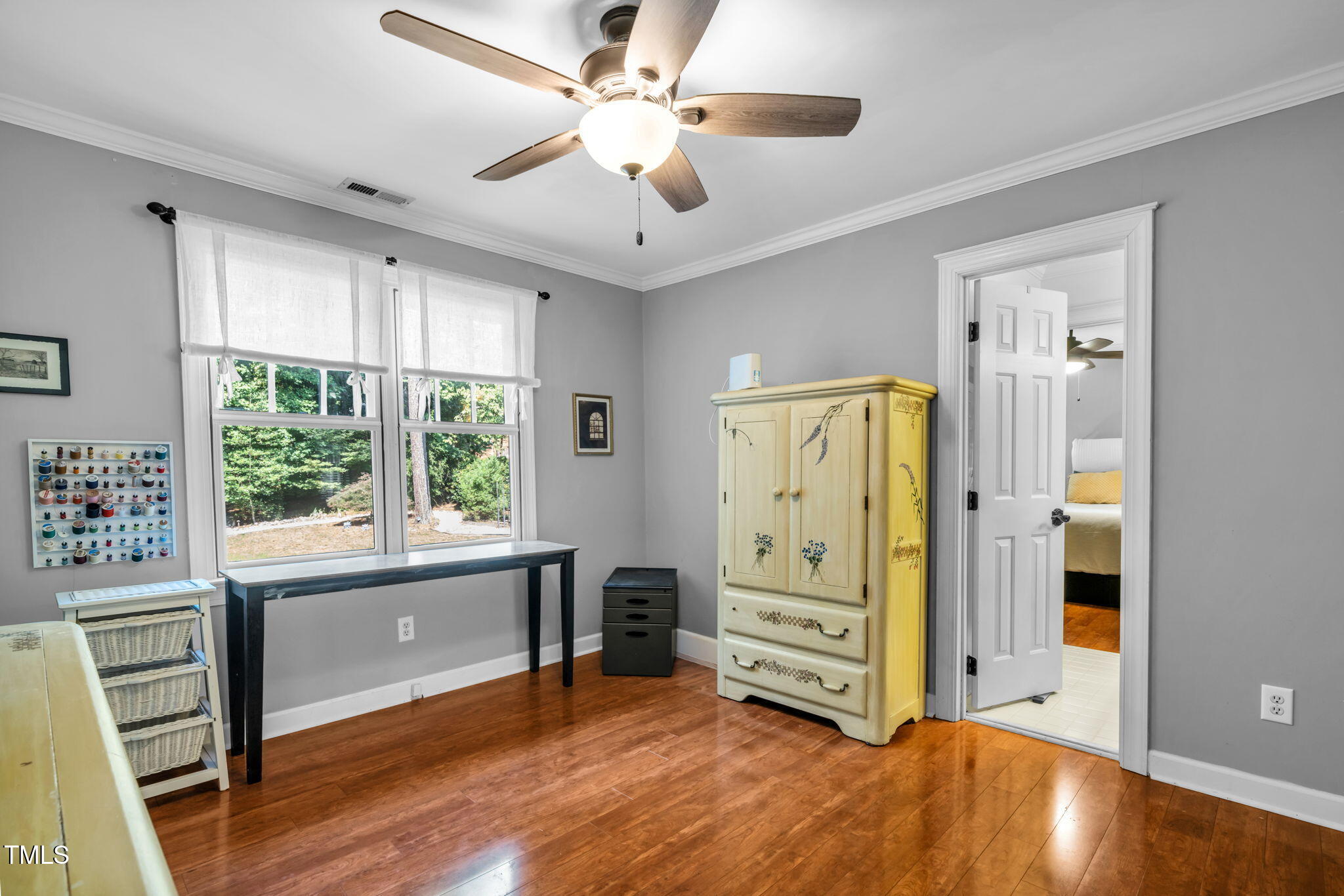 9009 Hometown Drive Raleigh, NC 27615 - Photo 44 of 82 a view of livingroom with hardwood floor and a ceiling fan