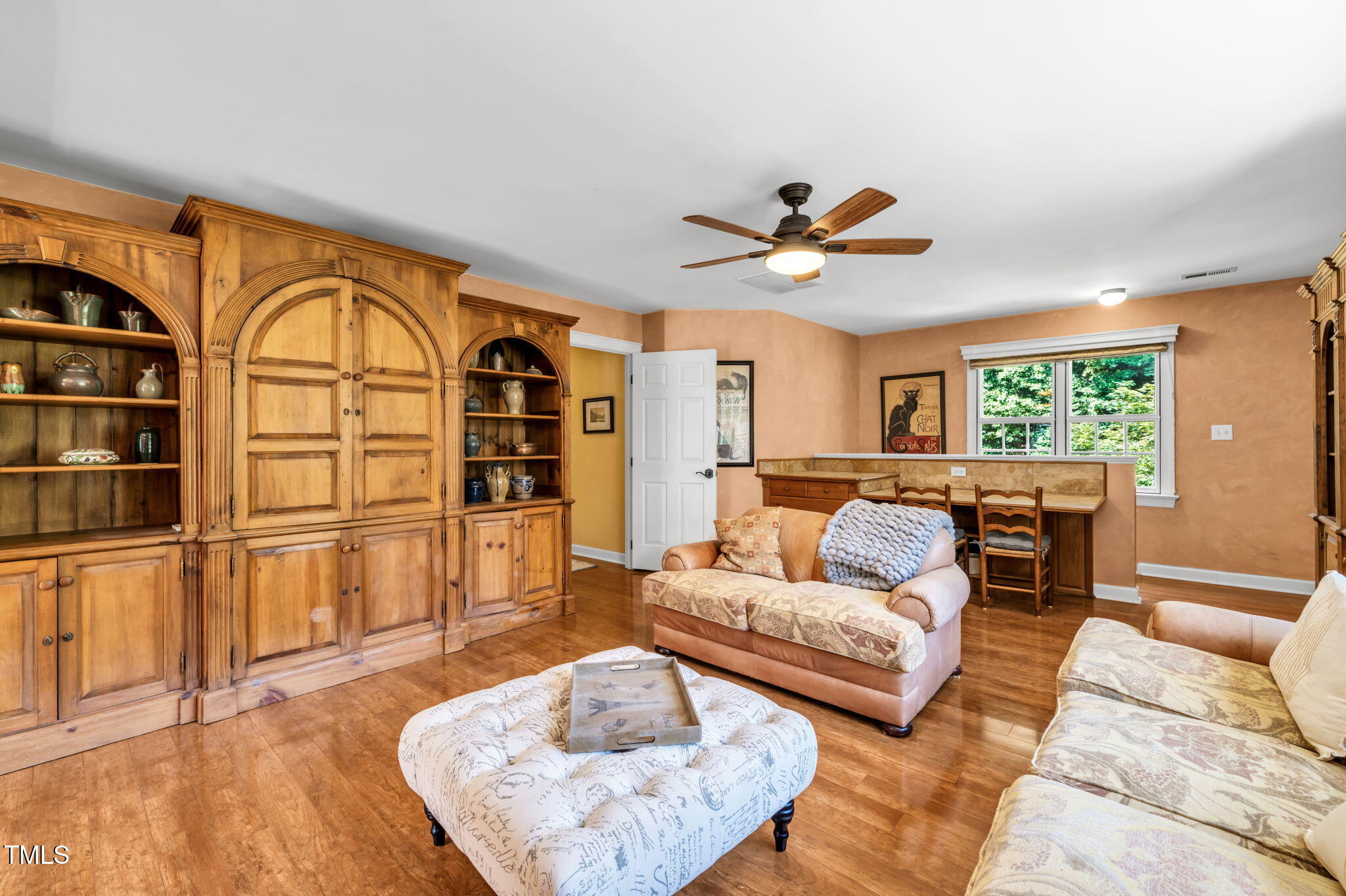 9009 Hometown Drive Raleigh, NC 27615 - Photo 48 of 82 a living room with furniture and a large window