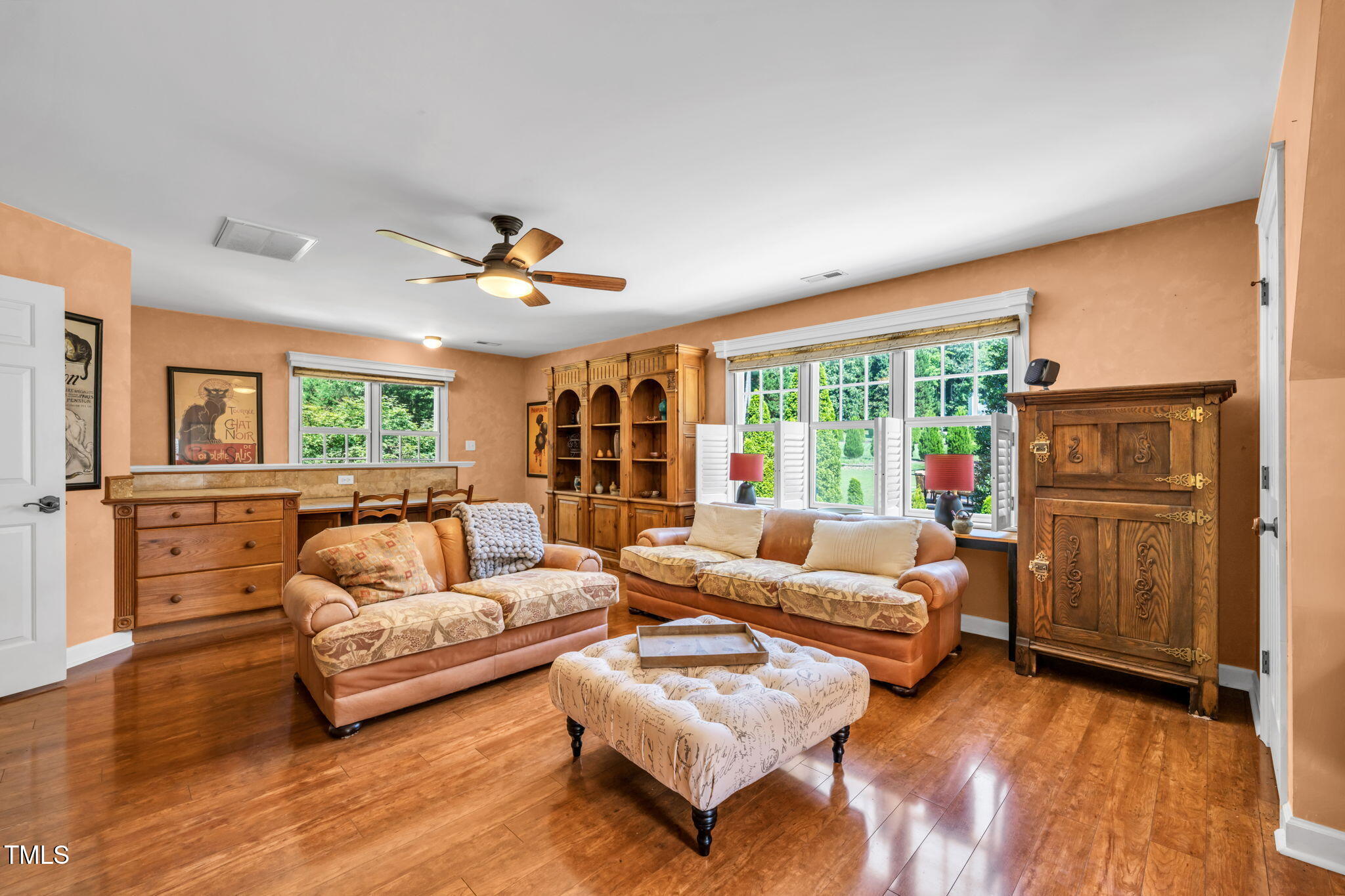 9009 Hometown Drive Raleigh, NC 27615 - Photo 49 of 82 a living room with furniture and a large window