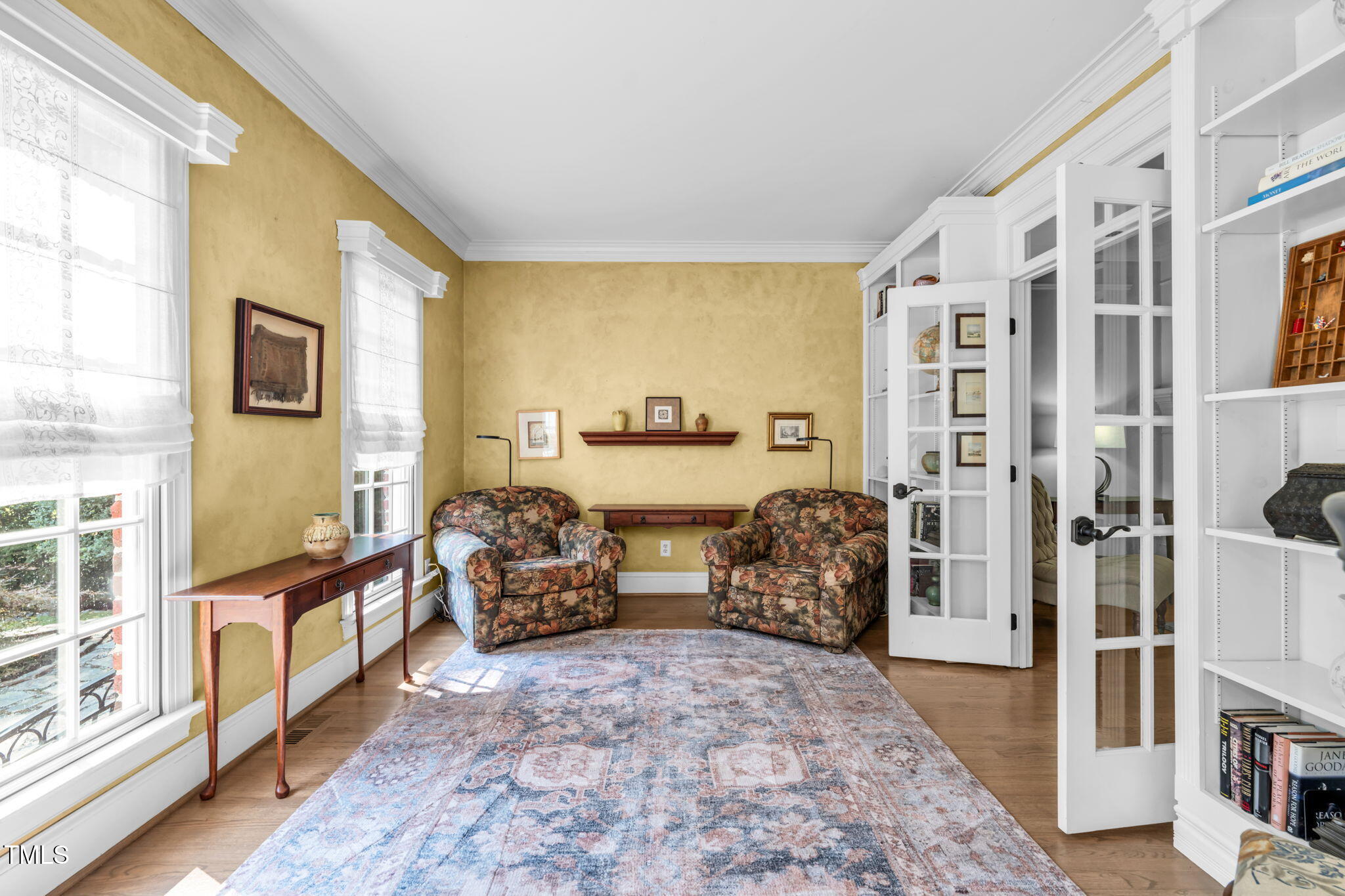 9009 Hometown Drive Raleigh, NC 27615 - Photo 4 of 82 a bedroom with furniture and a large window