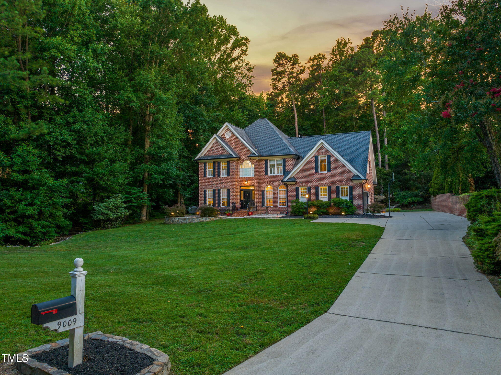 9009 Hometown Drive Raleigh, NC 27615 - Photo 73 of 82 a front view of a house with yard and green space