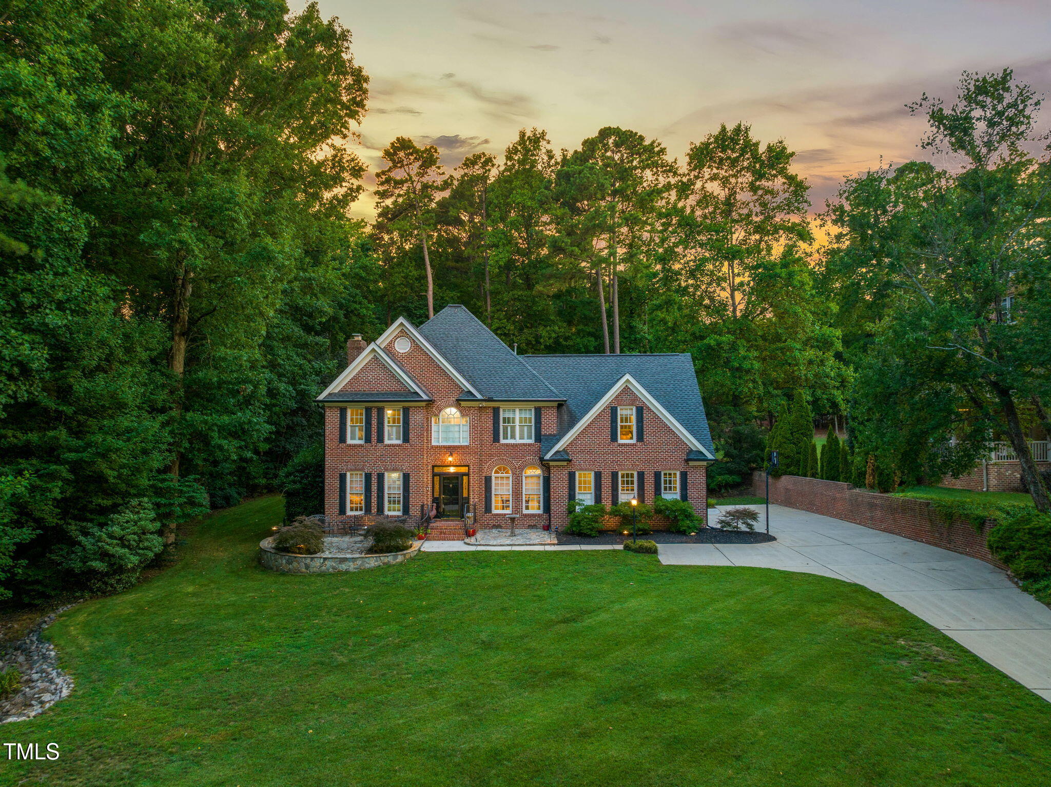 9009 Hometown Drive Raleigh, NC 27615 - Photo 74 of 82 a front view of a house with garden