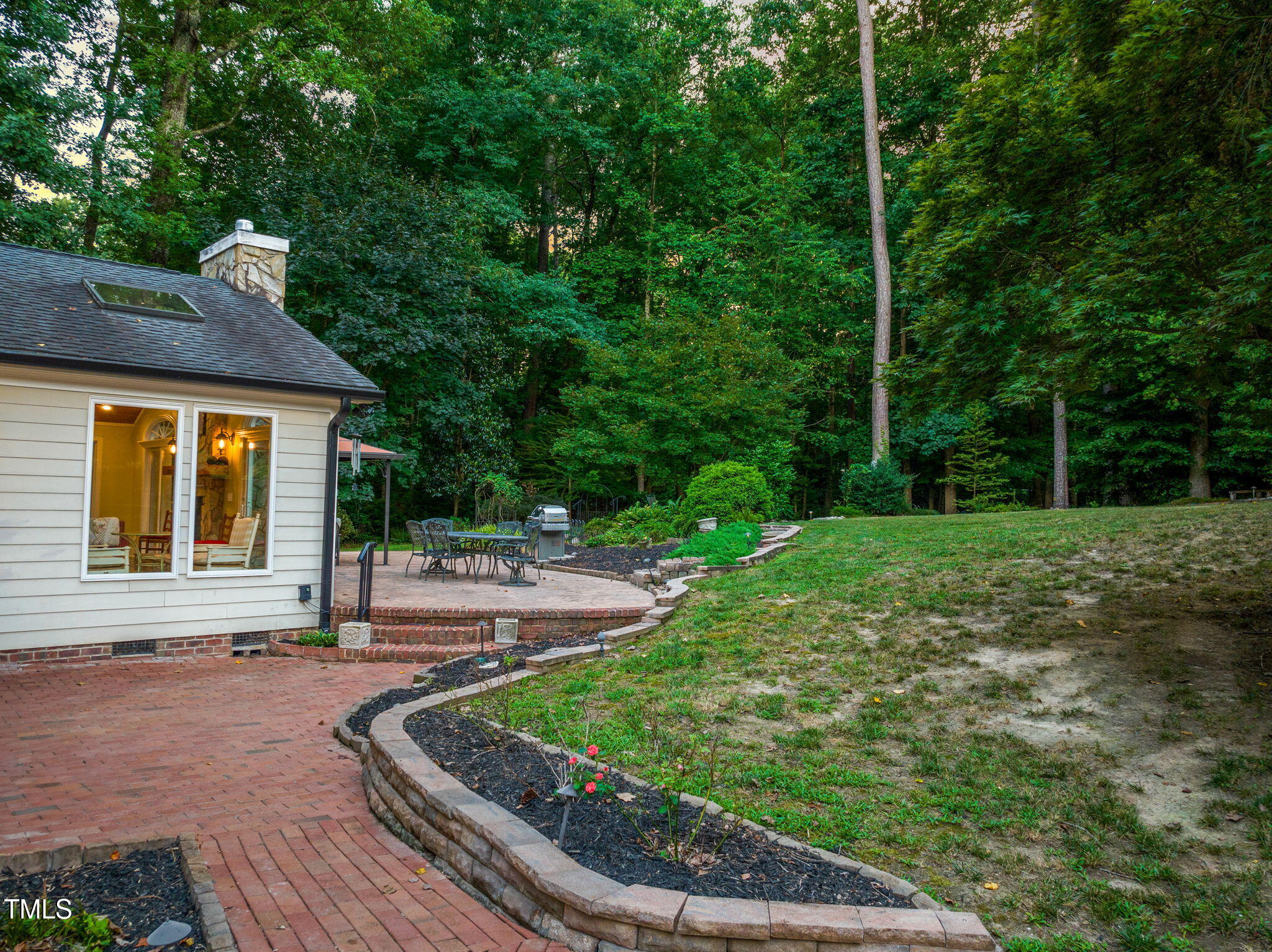 9009 Hometown Drive Raleigh, NC 27615 - Photo 76 of 82 a house with garden in front of it