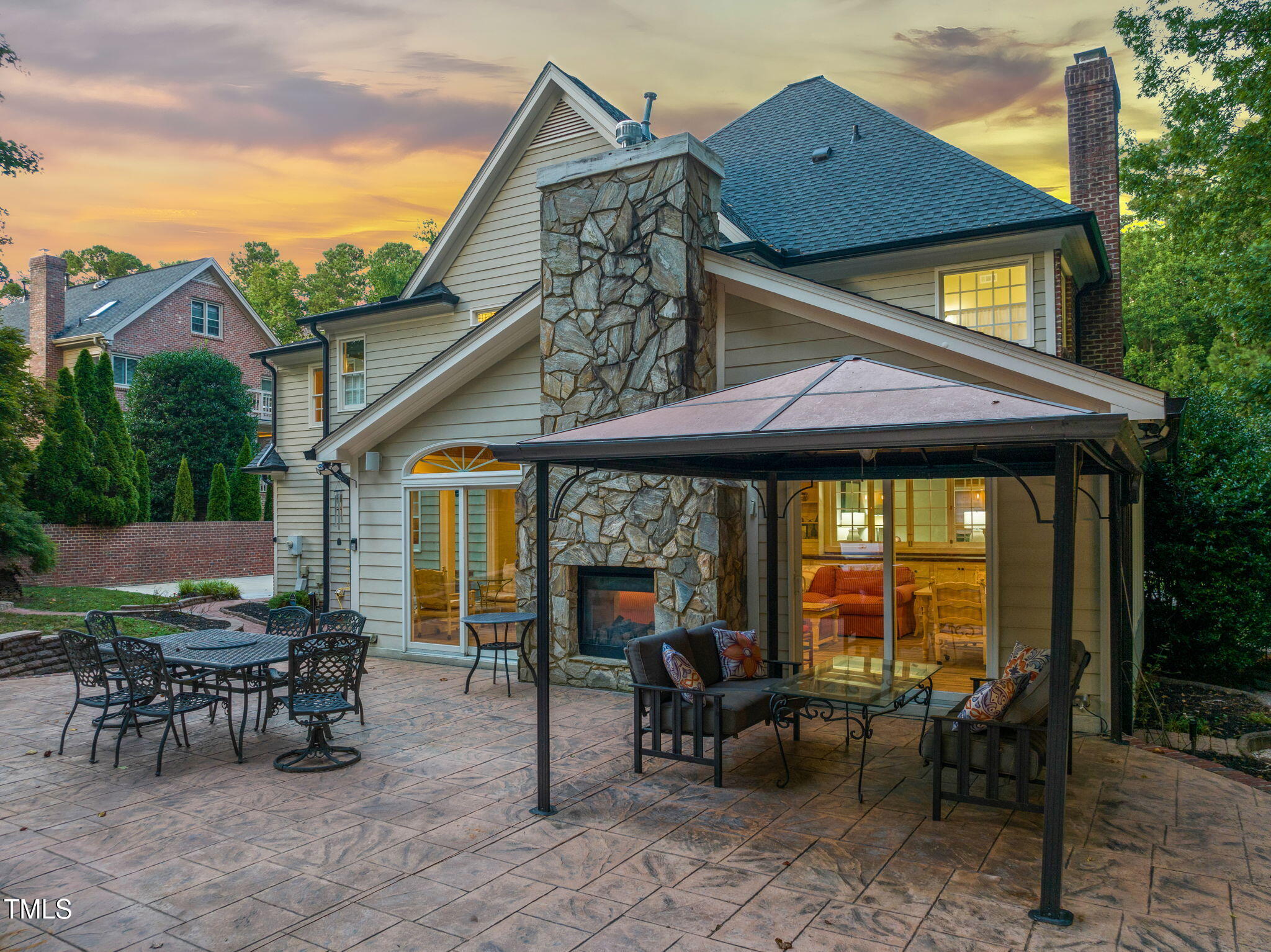 9009 Hometown Drive Raleigh, NC 27615 - Photo 79 of 82 a view of a house with backyard sitting area and garden