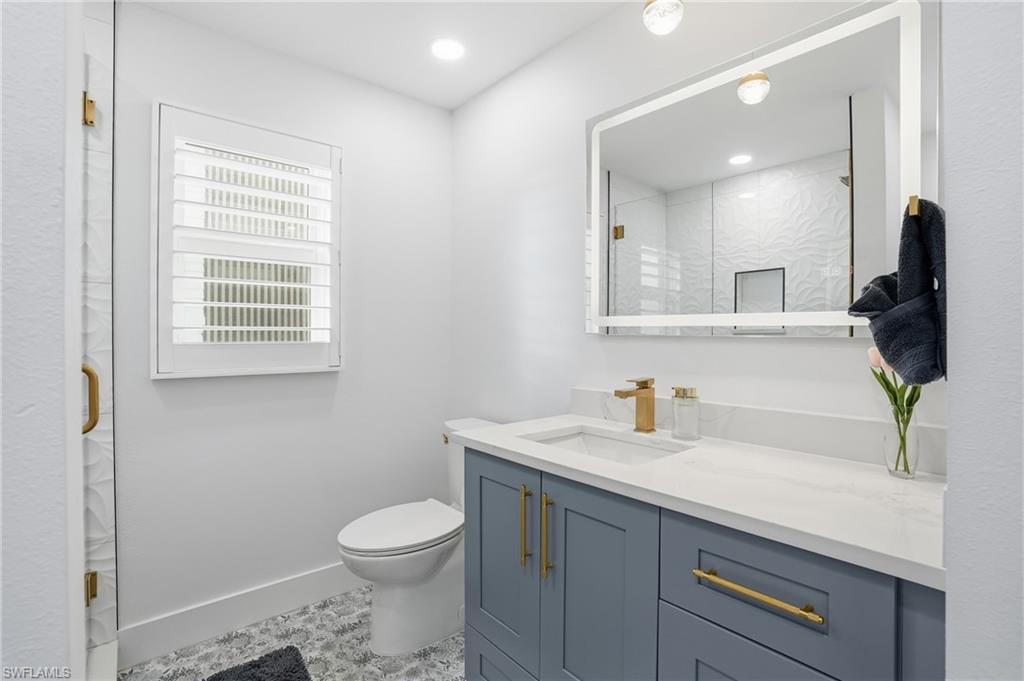 270 Dundee Road Fort Myers Beach, FL 33931 - Photo 30 of 48 Bathroom featuring vanity, a shower stall, and recessed lighting - Virtually Edited Image