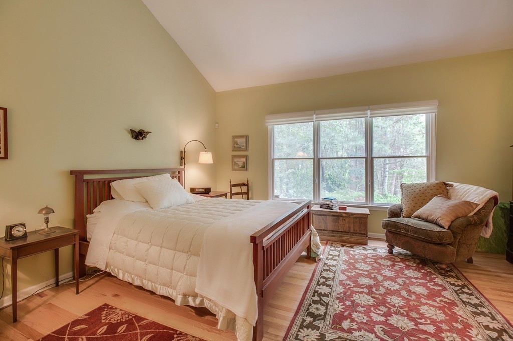 5 Emery Road, Unit 5 Bedford, MA 01730 - Photo 13 of 29 a bedroom with a bed and a couch