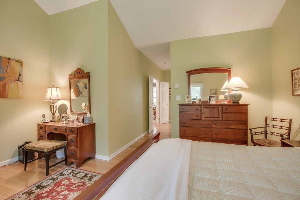 5 Emery Road, Unit 5 Bedford, MA 01730 - Photo 14 of 29 a bed room with a bed and a dresser