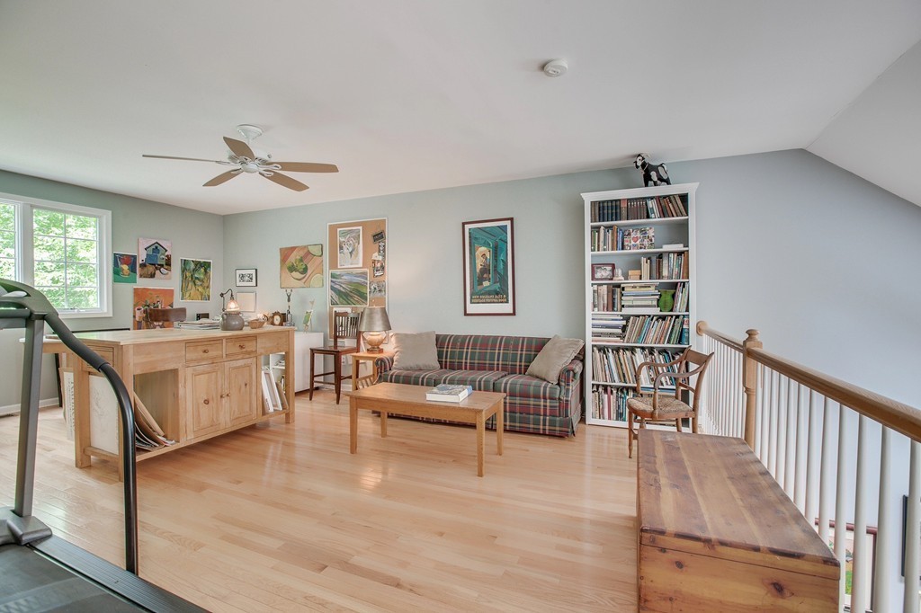 5 Emery Road, Unit 5 Bedford, MA 01730 - Photo 18 of 29 a living room with furniture and a wooden floor