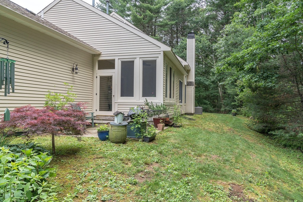 5 Emery Road, Unit 5 Bedford, MA 01730 - Photo 20 of 29 a backyard of a house with outdoor seating