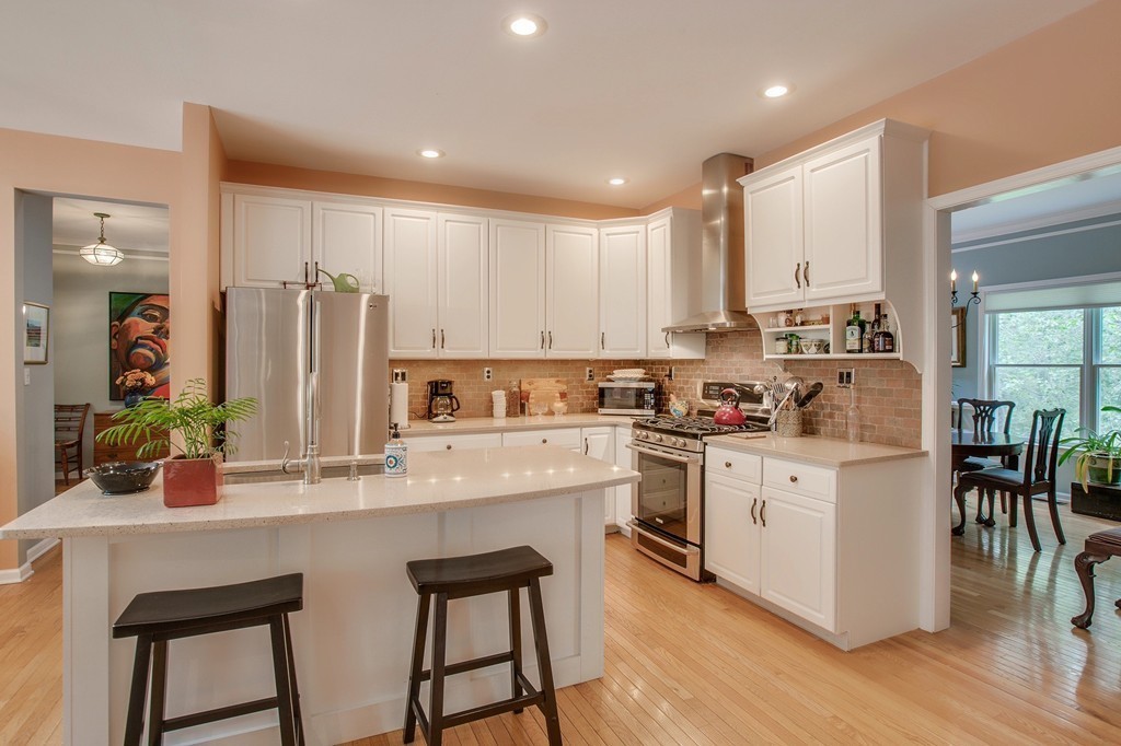 5 Emery Road, Unit 5 Bedford, MA 01730 - Photo 3 of 29 a kitchen with appliances a sink and cabinets