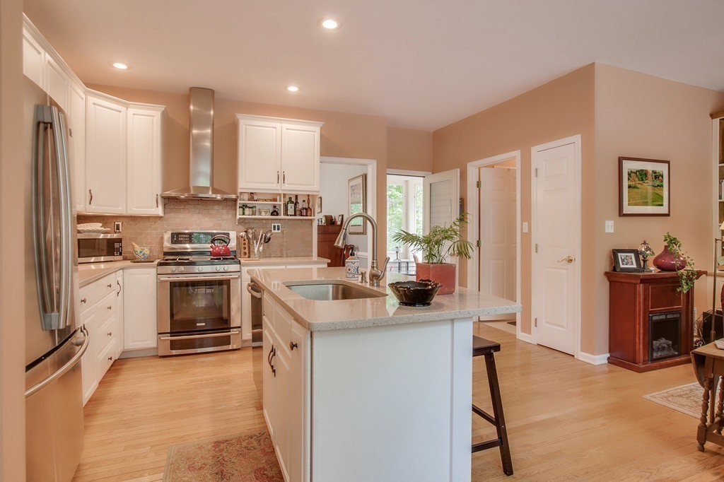 5 Emery Road, Unit 5 Bedford, MA 01730 - Photo 4 of 29 a kitchen with a sink stove and refrigerator
