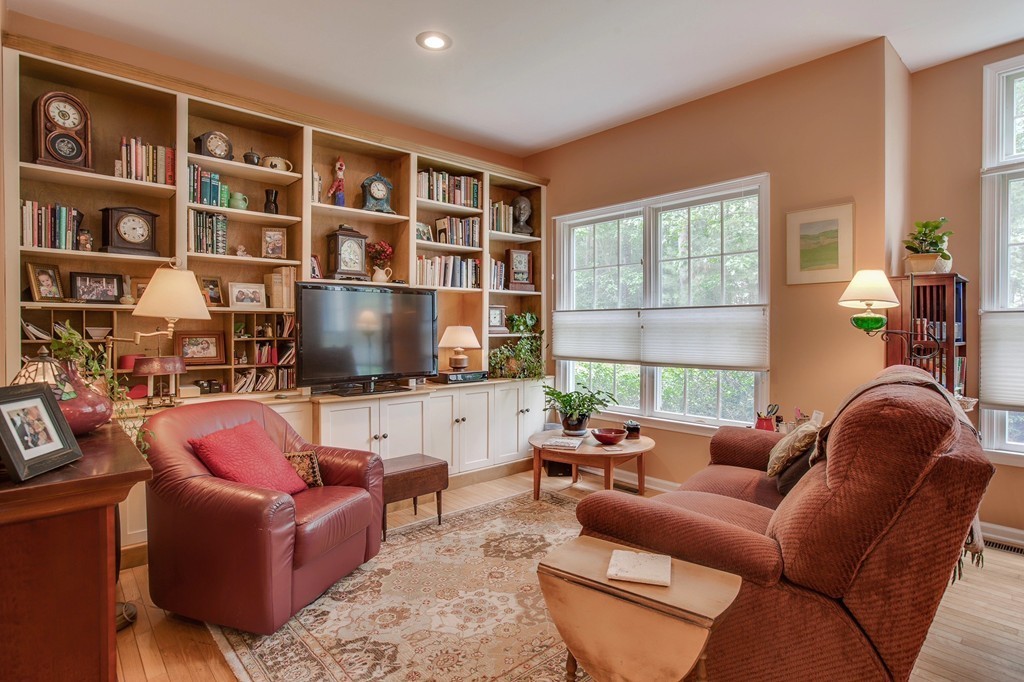5 Emery Road, Unit 5 Bedford, MA 01730 - Photo 7 of 29 a living room with furniture or window and a flat screen tv