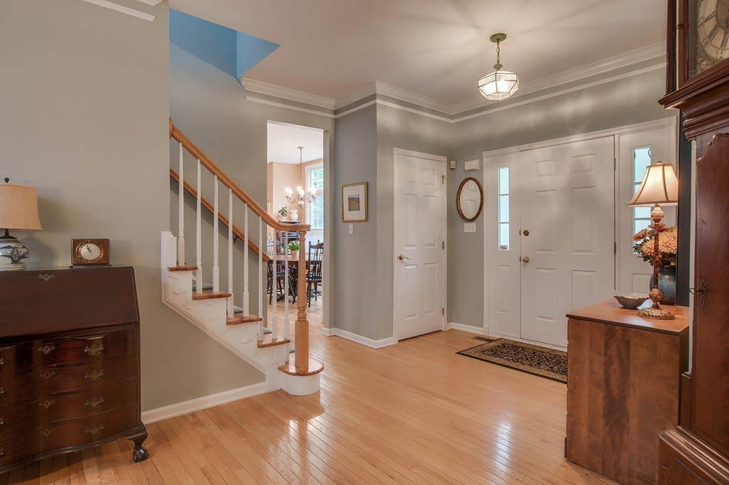 5 Emery Road, Unit 5 Bedford, MA 01730 - Photo 8 of 29 a view of a hallway with entryway and wooden floor