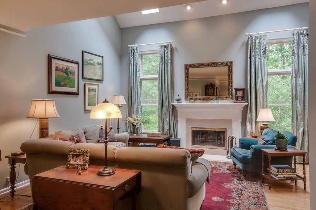 5 Emery Road, Unit 5 Bedford, MA 01730 - Photo 9 of 29 a living room with furniture and a fireplace