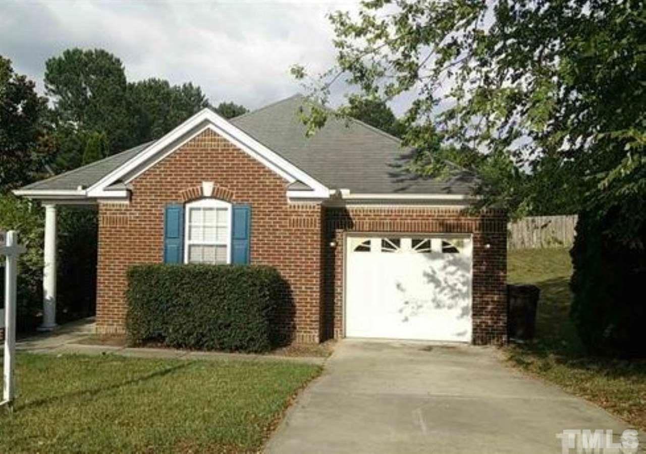 1229 Rutledge Landing Drive Knightdale, NC 27545 - Photo 1 of 15 a front view of a house with a yard and garage