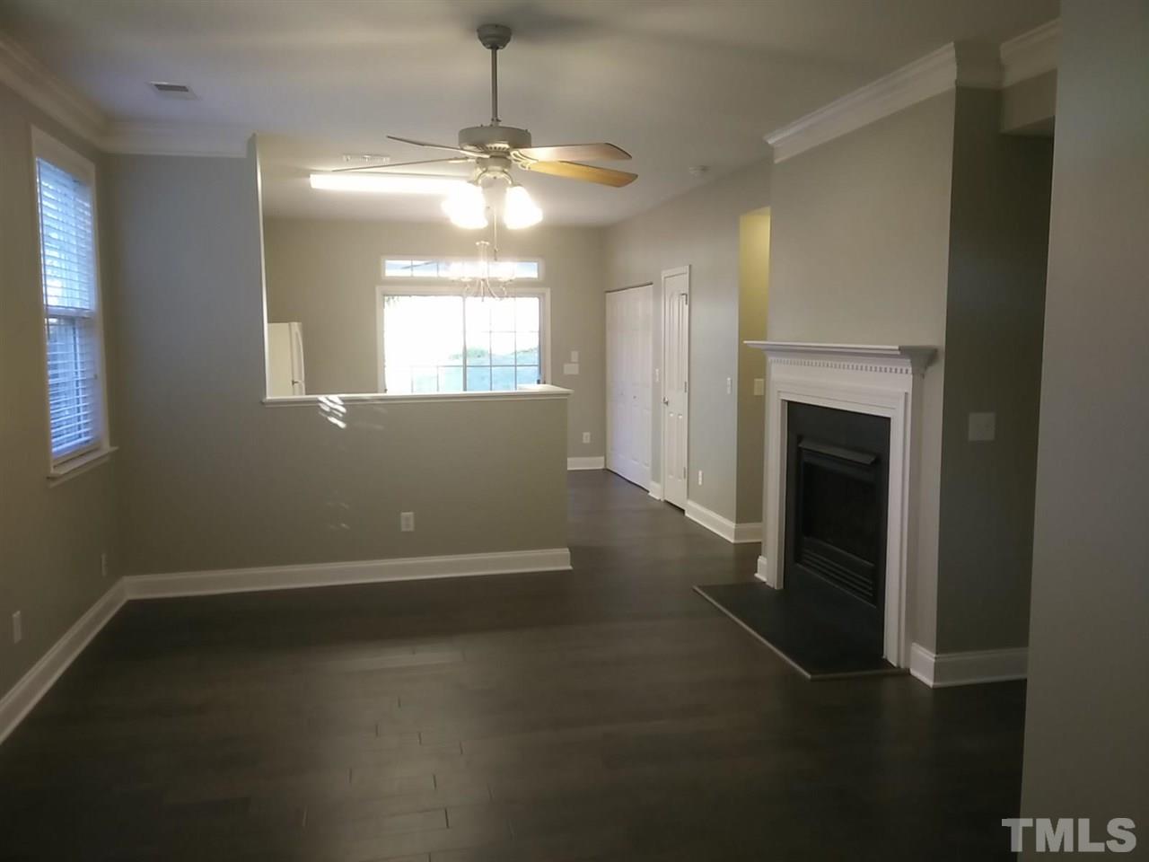 1229 Rutledge Landing Drive Knightdale, NC 27545 - Photo 3 of 15 an empty room with windows and fireplace