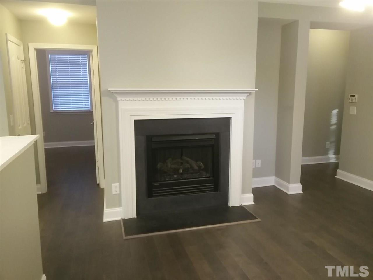 1229 Rutledge Landing Drive Knightdale, NC 27545 - Photo 5 of 15 a living room with furniture and a fireplace