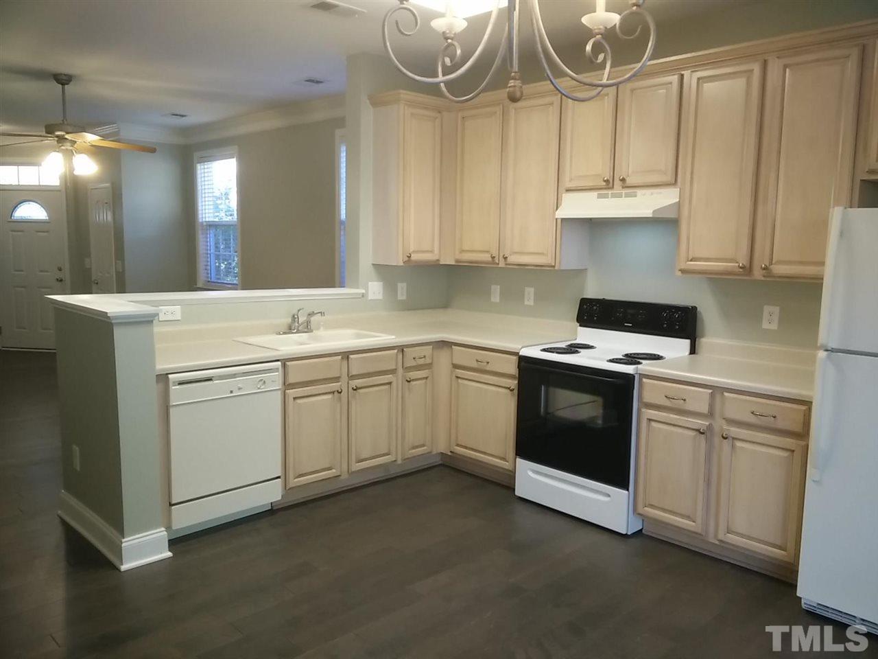 1229 Rutledge Landing Drive Knightdale, NC 27545 - Photo 6 of 15 a kitchen with cabinets appliances and a sink