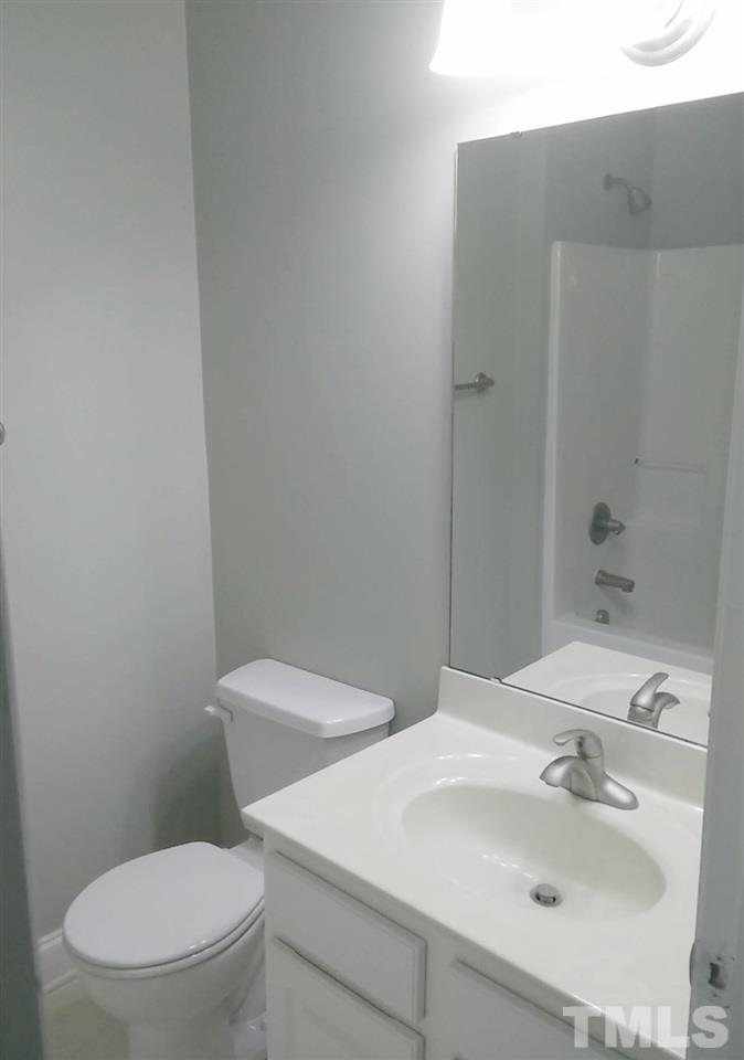 1229 Rutledge Landing Drive Knightdale, NC 27545 - Photo 10 of 15 a white toilet sitting next to a bathroom sink