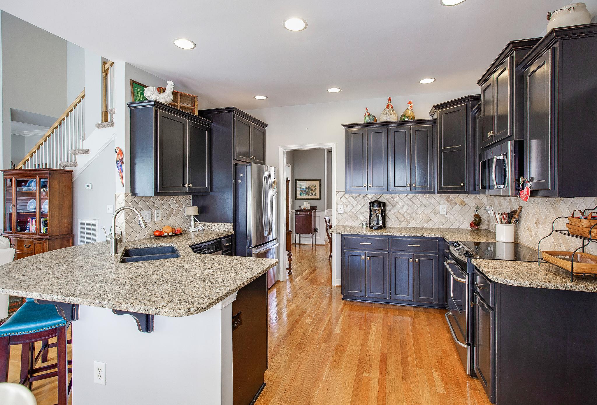 1017 Red Pepper Ridge Spring Hill, TN 37174 - Photo 11 of 27 Kitchen has newly customized granite countertops, and tile back splash.