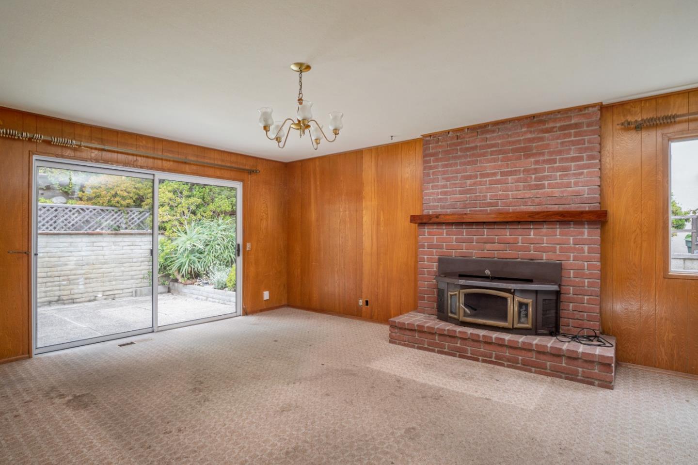 3010 Ribera Road Carmel, CA 93923 - Photo 8 of 16 a view of empty room with fireplace and fan
