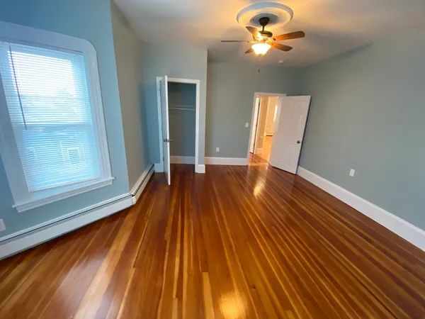 a view of room with a ceiling fan