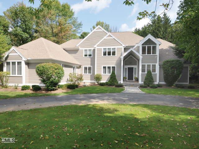 102 Norrans Ridge Drive Ridgefield, CT 06877 - Photo 1 of 1 a front view of a house with a yard