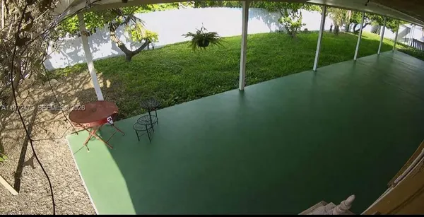 a backyard of a house with lots of green space