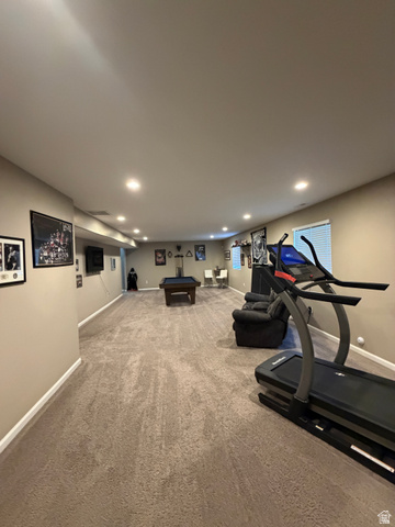 118 Tram Rock Rd. Lake Point, UT 84074 - Photo 19 of 34 Spacious lower-level room featuring recessed lighting, neutral wall tones, and carpet flooring