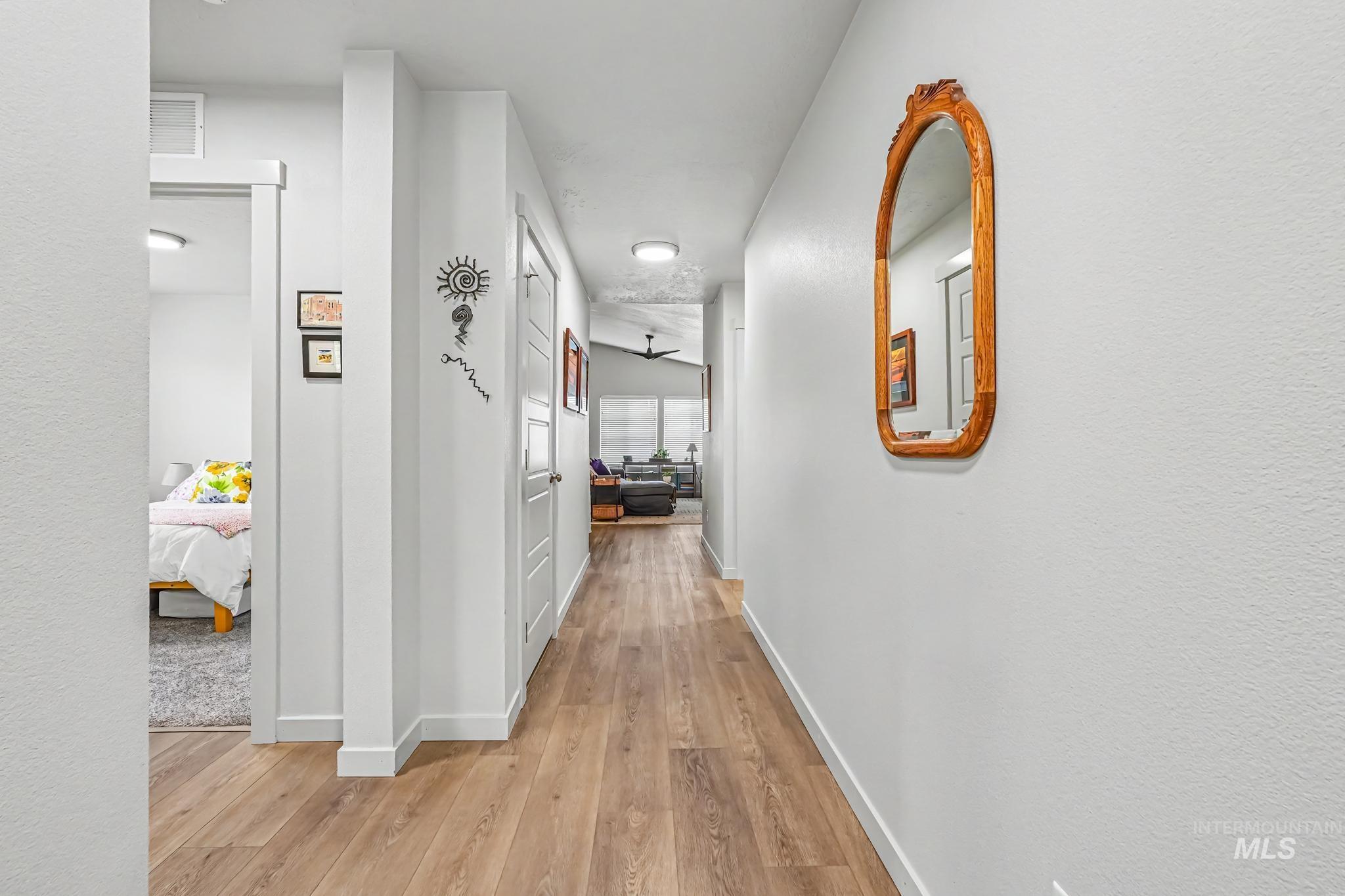 238 West Riggs Spring Avenue Meridian, ID 83642 - Photo 3 of 16 Hard-surface flooring throughout the hallway