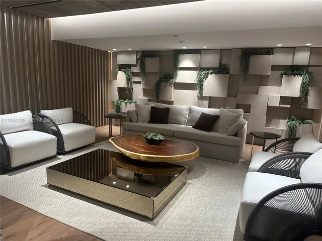 a living room with furniture and a lamp