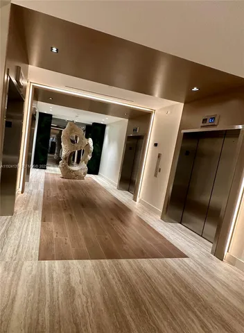 a view of a living room with wooden floor