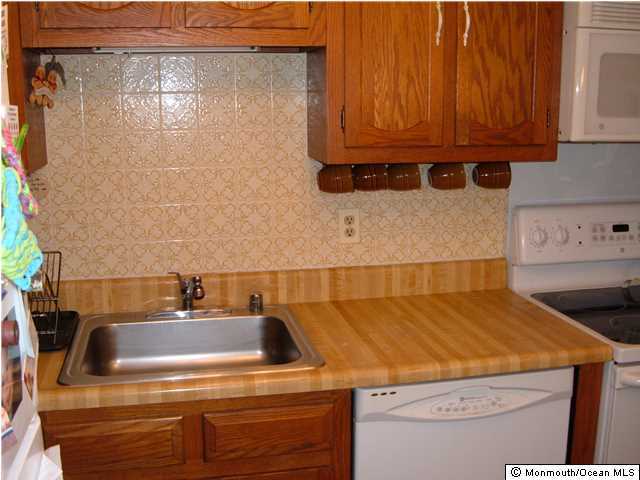 12 Stonybrook Road Whiting, NJ 08759 - Photo 13 of 25 a bathroom with a sink a toilet and vanity