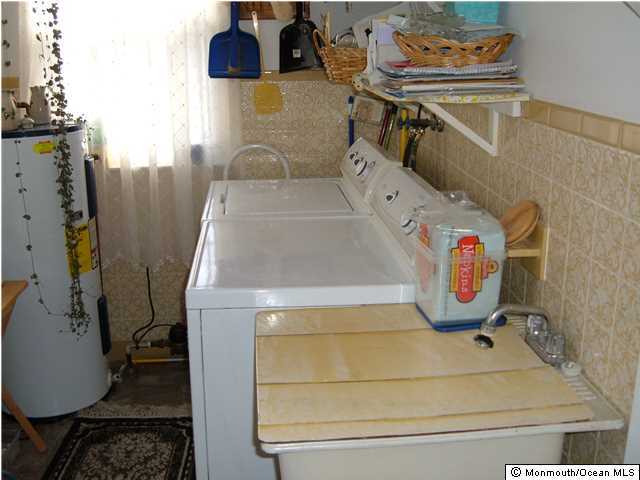 12 Stonybrook Road Whiting, NJ 08759 - Photo 16 of 25 a utility room with dryer and washer