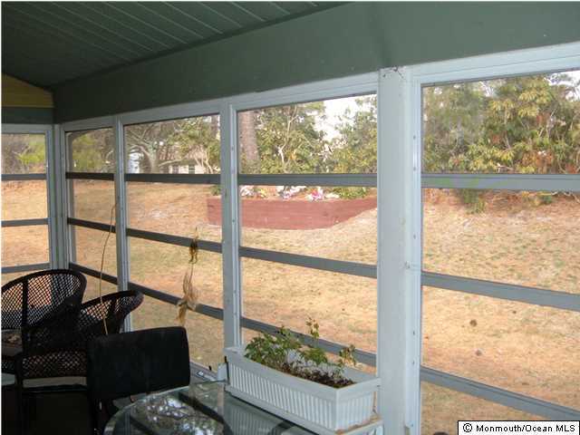 12 Stonybrook Road Whiting, NJ 08759 - Photo 19 of 25 a view of a glass door with a view from a balcony