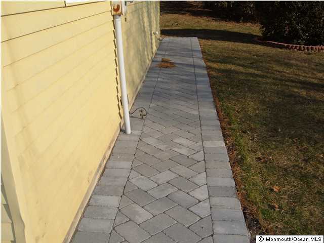 12 Stonybrook Road Whiting, NJ 08759 - Photo 2 of 25 a view of a pathway both side of a house