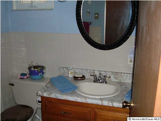12 Stonybrook Road Whiting, NJ 08759 - Photo 24 of 25 a bathroom with a sink and a mirror