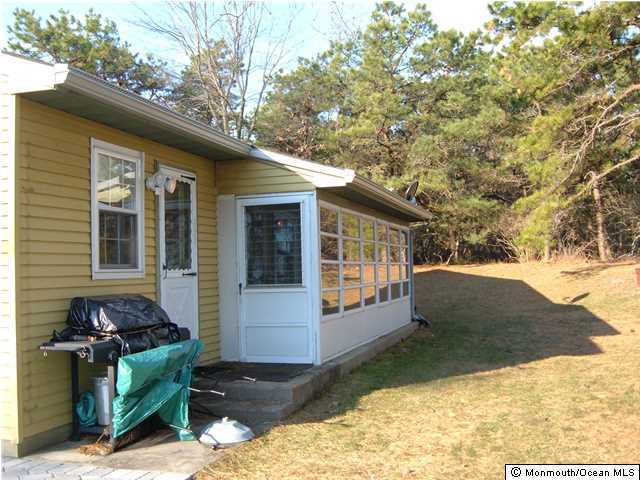 12 Stonybrook Road Whiting, NJ 08759 - Photo 4 of 25 a view of backyard of the house