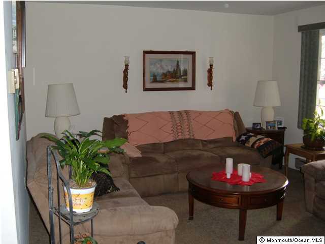 12 Stonybrook Road Whiting, NJ 08759 - Photo 7 of 25 a living room with furniture and a lamp