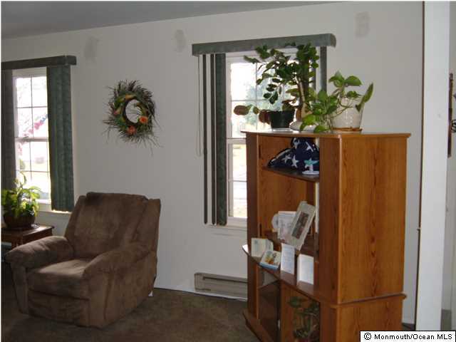 12 Stonybrook Road Whiting, NJ 08759 - Photo 8 of 25 a living room with furniture and a potted plant