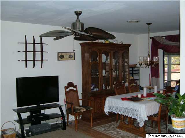 12 Stonybrook Road Whiting, NJ 08759 - Photo 9 of 25 a living room with furniture and a flat screen tv