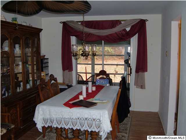 12 Stonybrook Road Whiting, NJ 08759 - Photo 10 of 25 a bedroom with furniture and large windows